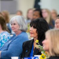 Audience members listening to speaker 7
